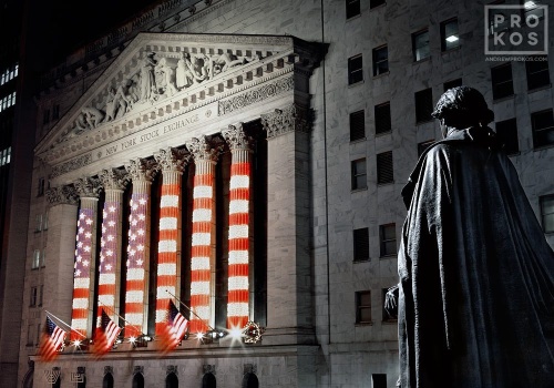 An architectural fine art photo of the New York Stock Exchange (NYSE) and statue of George Washington at night from Federal Hall