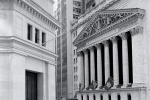 A black and white fine art architectural photo of the New York Stock Exchange (NYSE) as seen from Wall Street