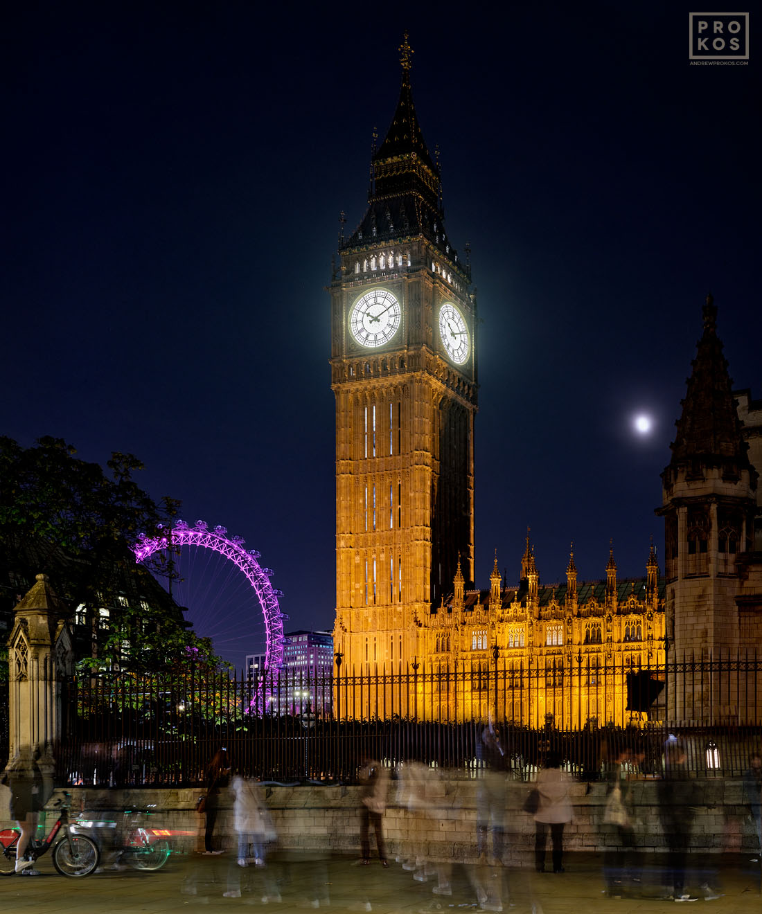 A long-exposure view of visitors in front of Big Ben at night by fine art photographer Andrew Prokos, London, United Kingdom. Large-format fine art prints of this photo are available up to 80 inches in height.