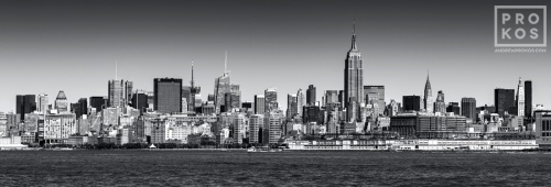 A black and white panoramic skyline of New York City and the Hudson River, available as a large-format fine art print framed in various styles.