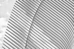 A black and white architectural detail photo of the exterior of the Oculus at World Trade Center Station, New York City by architect Santiago Calatrava. Large-scale framed prints of this photo are available up to 72 inches in width