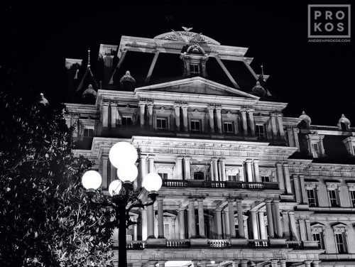 A black and white view of the Old Executive Office Building at night, Washington D.C. Andrew's photos are available as fine art prints framed in various styles.