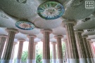 A canopy of monumental columns and ornate mosaic ceiling roundels from Antoni Gaudi's Parc Guell in Barcelona, Spain. Fine art prints of this photo are available framed in various styles.