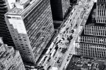 A view of Park Avenue NYC from above, with traffic and surrounding skyscrapers.