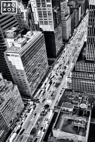 A view of Park Avenue NYC from above, with traffic and surrounding skyscrapers.