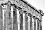 A black and white photograph of the Doric columns from the Eastern facade of the Parthenon in Athens, Greece
