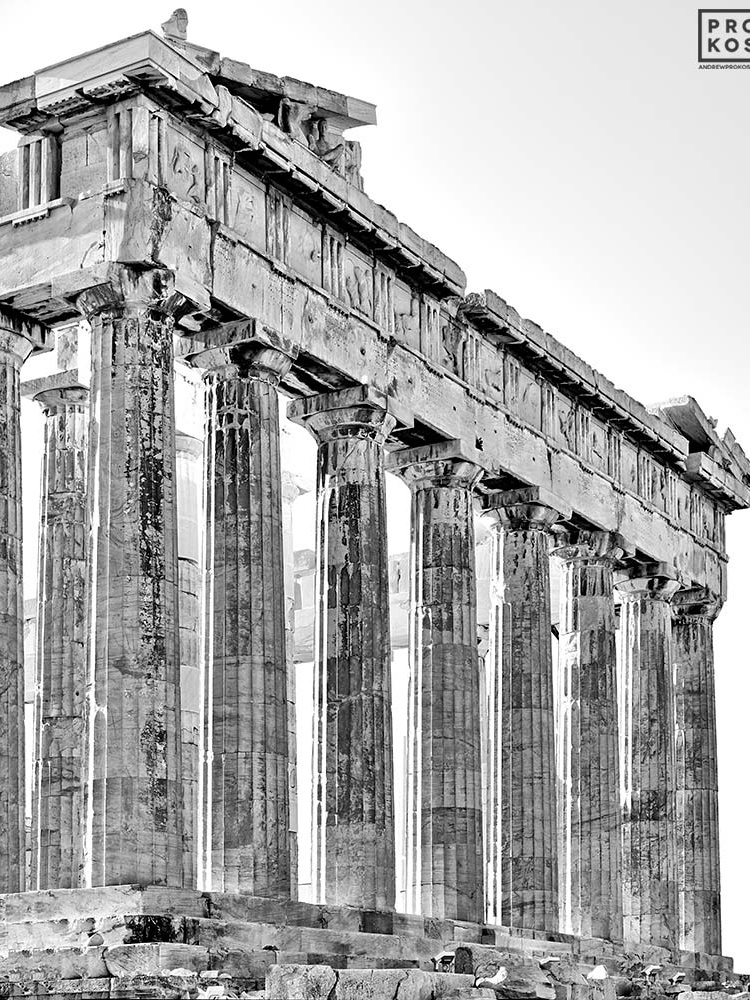 A black and white photograph of the Doric columns from the Eastern facade of the Parthenon in Athens, Greece