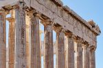 A color fine art photograph of the Doric columns from the Eastern facade of the Parthenon in Athens, Greece