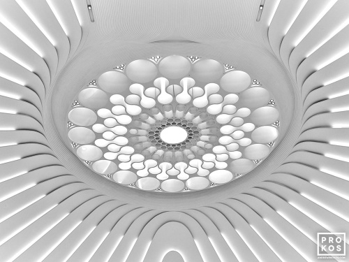Black and white architectural photography of an oculus from the interior of contemporary architecture by architect Santiago Calatrava. Large-scale fine art prints of this photo are available up to 80 inches and framed in wood, metal and acrylic styles.