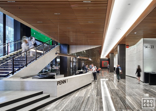 An interior view of the lobby and concierge desk at Penn 1 tower, New York City. The interior architect is A+I (architecture Plus Information). Photographed by architectural photographer Andrew Prokos for Vornado Realty Trust. Fine art prints of this photo are available in various sizes.