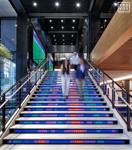 An interior view of the illuminated Digital Stairs at Penn 1 tower, New York City. The interior architect is A+I (architecture Plus Information). Photographed by architectural photographer Andrew Prokos for Vornado Realty Trust. Fine art prints of this photo are available in various sizes.