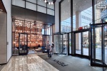An interior view of the lobby and library at Penn 1 tower, New York City. The interior architect is A+I (architecture Plus Information). Photographed by architectural photographer Andrew Prokos for Vornado Realty Trust. Fine art prints of this photo are available in various sizes.