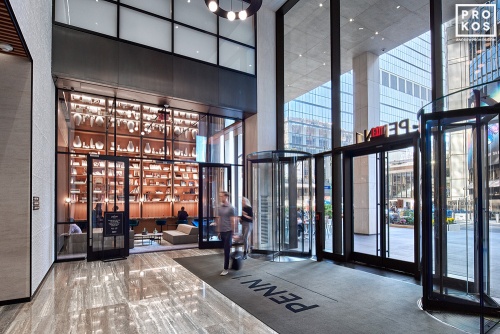 An interior view of the lobby and library at Penn 1 tower, New York City. The interior architect is A+I (architecture Plus Information). Photographed by architectural photographer Andrew Prokos for Vornado Realty Trust. Fine art prints of this photo are available in various sizes.