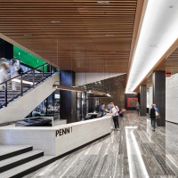 An interior view of the lobby and concierge desk at Penn 1 tower, New York City. The interior architect is A+I (architecture Plus Information). Photographed by architectural photographer Andrew Prokos for Vornado Realty Trust. Fine art prints of this photo are available in various sizes.