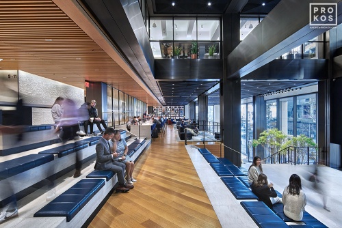 A view of the soaring 'Social Stairs' interior space at Penn 1 tower in New York City. Photographed by architectural photographer Andrew Prokos for Vornado Realty Trust. Fine art prints of this photo are available in various sizes.