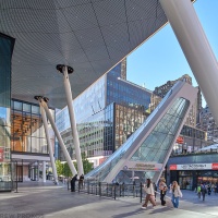 An exterior view of Penn 2 tower and the new entrance to Penn Station at 34th St. and 7th Ave. by MdeAS Architects, New York City. Photographed by architectural photographer Andrew Prokos for Vornado / The Penn District. Fine art prints of this photo are available framed in various styles