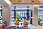 An interior view of the sky lobby at Penn 2 tower with a view towards the sky lobby terrace, New York City. Photographed by architectural photographer Andrew Prokos for Vornado Realty Trust. Fine art prints of this photo are available in various sizes.
