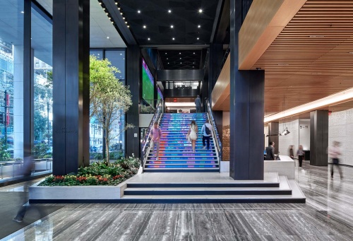 An interior view of the lobby and Digital Stairs at Penn 1 tower, New York City. The interior architect is A+I (architecture Plus Information). Photographed by architectural photographer Andrew Prokos for Vornado Realty Trust. Fine art prints of this photo are available in various sizes.