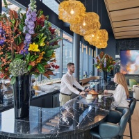 A view of the bar at The Perch, the roof terrace at Penn 2, Manhattan, NYC. Photographed by architectural photographer Andrew Prokos for Vornado Realty Trust.