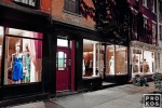 A long-exposure fine art photo of the illuminated store windows on Perry Street at night, West Village, New York City