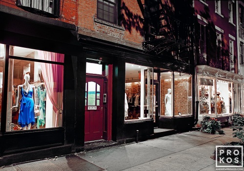 A long-exposure fine art photo of the illuminated store windows on Perry Street at night, West Village, New York City