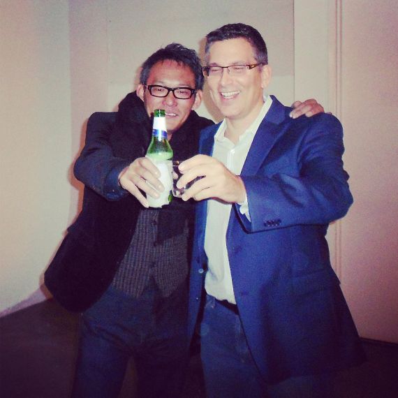 Photographers Andrew Prokos and Michael Hitoshi celebrate after the International Photography Awards event
