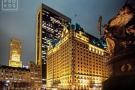 A wide angle photo of the Plaza Hotel at night, New York City