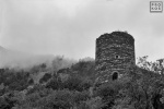 The ruins of an ancient stone tower shrouded in mist in the Pyrenees Mountains, Spain. Fine art prints of this photo are available framed in various styles, please inquire. 