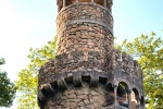 An exterior view of the tower of the Poço Iniciático, a hidden well with arched spiral stairway in the Quinta da Regaleira gardens of Sintra, Portugal. Limited edition fine art prints of this photo are available framed in various styles. 