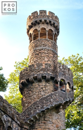 An exterior view of the tower of the Poço Iniciático, a hidden well with arched spiral stairway in the Quinta da Regaleira gardens of Sintra, Portugal. Limited edition fine art prints of this photo are available framed in various styles. 