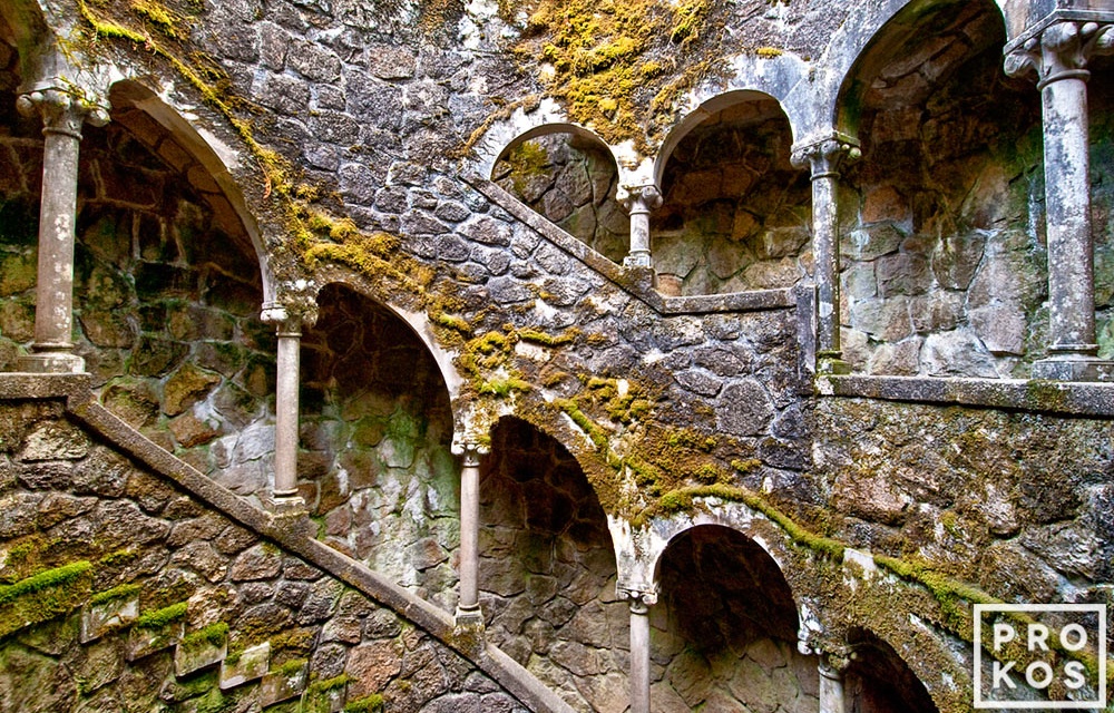 The Poço Iniciático, a hidden well with arched spiral stairway in the Quinta da Regaleira gardens of Sintra, Portugal. Limited edition fine art prints of this photo are available framed in various styles. 
