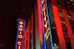 Night photography of the neon signs of Radio City Music Hall at night, New York City. Fine art prints of this photo are available up to 60 inches and framed in various styles.