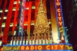 A long-exposure night photo of Radio City Music Hall at Christmas, New York City