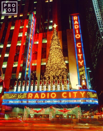 A long-exposure night photo of Radio City Music Hall at Christmas, New York City