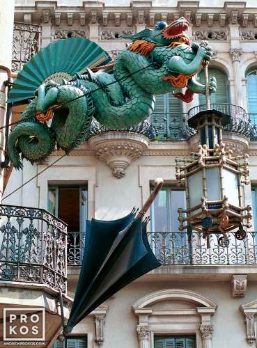 A photo of the famous cast iron dragon on the facade of a former umbrella shop, Las Ramblas, Barcelona, Spain