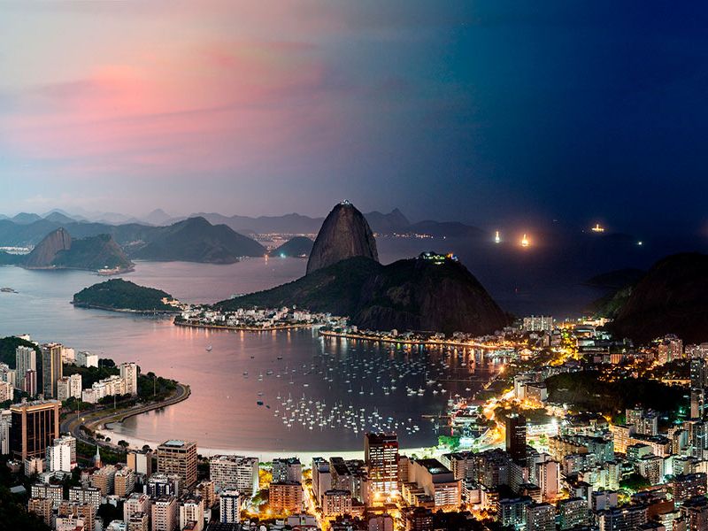 An ultra high-definition panoramic cityscape photo of Rio de Janeiro, Brazil transitioning from day to night, from Andrew's award-winning Night & Day series. Large-scale fine art prints of this photo are available up to 90 inches wide.