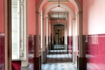 A fine art architectural photo of an interior in shades of pink and maroon, in Rio de Janeiro's Centro Historico.