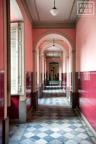 A fine art architectural photo of an interior in shades of pink and maroon, in Rio de Janeiro's Centro Historico.