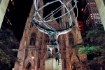 A view of Rockefeller Center's Atlas statue and St. Patrick's Cathedral at night, New York City. Fine art prints of this photo are available framed in various styles.