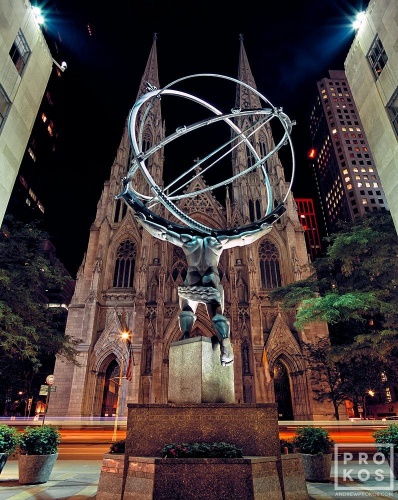 A view of Rockefeller Center's Atlas statue and St. Patrick's Cathedral at night, New York City. Fine art prints of this photo are available framed in various styles.