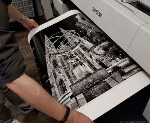 Black and White Photography - Rockefeller Center Atlas and St. Patrick's Cathedral at Night Black and White Print by Photographer Andrew Prokos