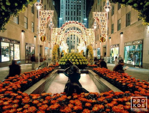 A high-definition photo of Rockefeller Center's Channel Gardens illuminated at night