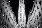 A black and white architectural photo of Rockefeller Center illuminated at night, New York City. Fine art prints of this photo are available framed in various styles. 