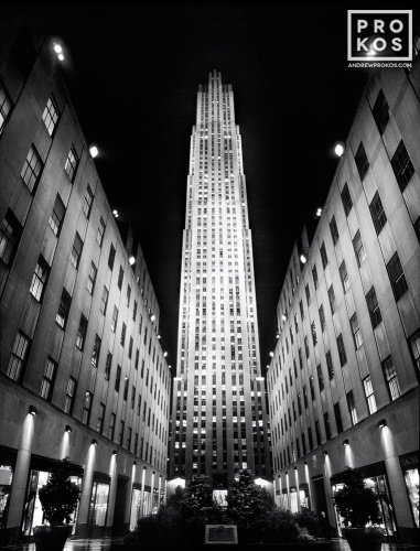 A black and white architectural photo of Rockefeller Center illuminated at night, New York City. Fine art prints of this photo are available framed in various styles. 