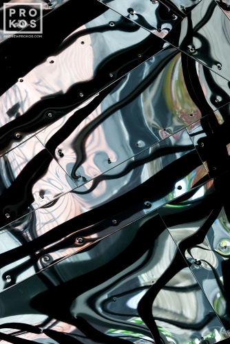 An abstract fine art photo of reflections on a polished metal interior from the series "Audacity of Color"