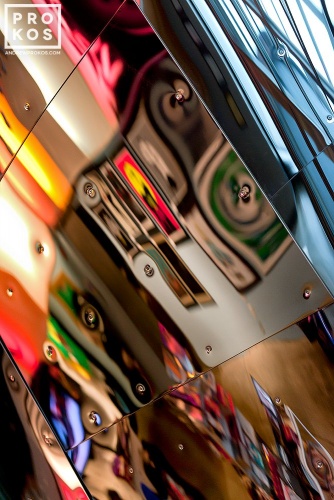 An abstract fine art photo of colorful reflections on a polished metal surface from the series "Audacity of Color"