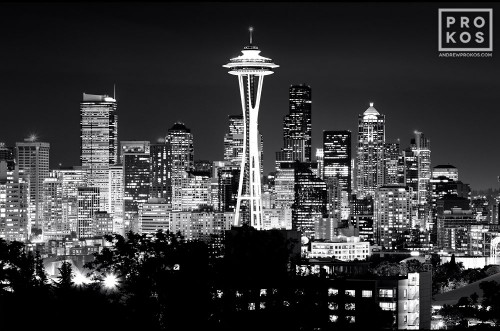 A photograph of the Seattle, Washington skyline at night in black and white