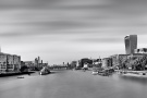 A sweeping black and white panoramic skyline of London, England, including the skyscrapers of the City of London, The Shard, City Hall and the Tower of London