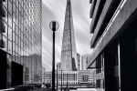 A black and white photo of The Shard skyscraper in London, United Kingdom captured in a four minute long exposure by photographer Andrew Prokos