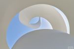 Fine art photography of a spiral architectural detail from the monument at Sharjah's House of Wisdom, United Arab Emirates. Large-scale fine art prints of this photo are available up to 72 inches and framed in wood, metal, and acrylic styles. 